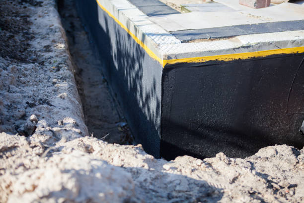 Professional Waterproofing technician working in Laurel, MD